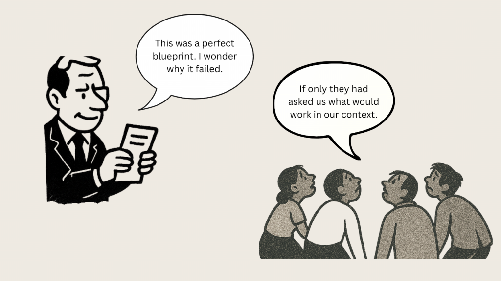 A suited man puzzled over a failed blueprint, while locals remark they were never asked what would work in their context.